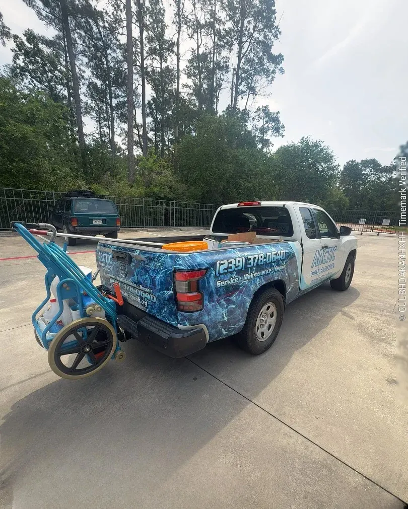 Arctic Pools & Spas truck loaded with pool equipment